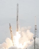 The Dragon spacecraft being launched on a Falcon 9 v1.0 rocket.