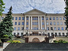 Exterior of a large building with steps and columns