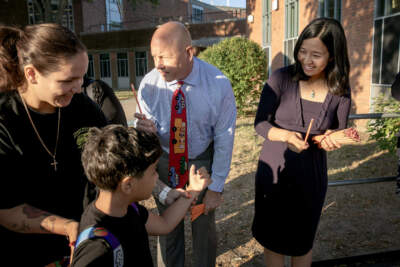 Mayor Michelle Wu greets students arriving for the first day of school. (Robin Lubbock/WBUR)