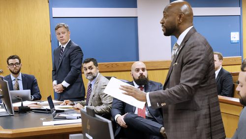 Lawyers representing Kenneth Chesboro and Sidney Powell watch Special Prosecutor Nathan Wade (center), representing the District Attorney's office, argued before Fulton County Superior Judge Scott McAfee. on Thursday, Sept. 14, 2023.
Miguel Martinez /miguel.martinezjimenez@ajc.com