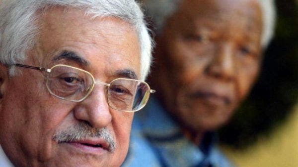 Palestinian Authority President Mahmoud Abbas and the former South African President Nelson Mandela pose at Mandela's house inJohannesburg 01 April 2006.Abbas said he considered Mandela as the father of all liberation movements. [Getty Images]