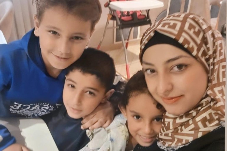 A photo of the author's relative Alaa along with three of her children [Courtesy of Ghada Ageel]