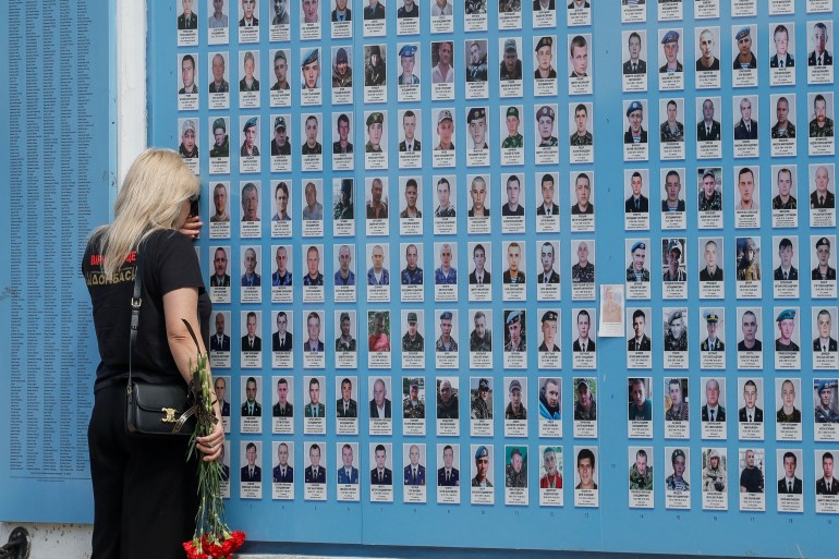 A woman visits the Memory Wall of Fallen Defenders of Ukraine as Ukrainians mark Day of Heroes, amid Russia's attack on Ukraine, in Kyiv, Ukraine May 23, 2024. REUTERS/Gleb Garanich