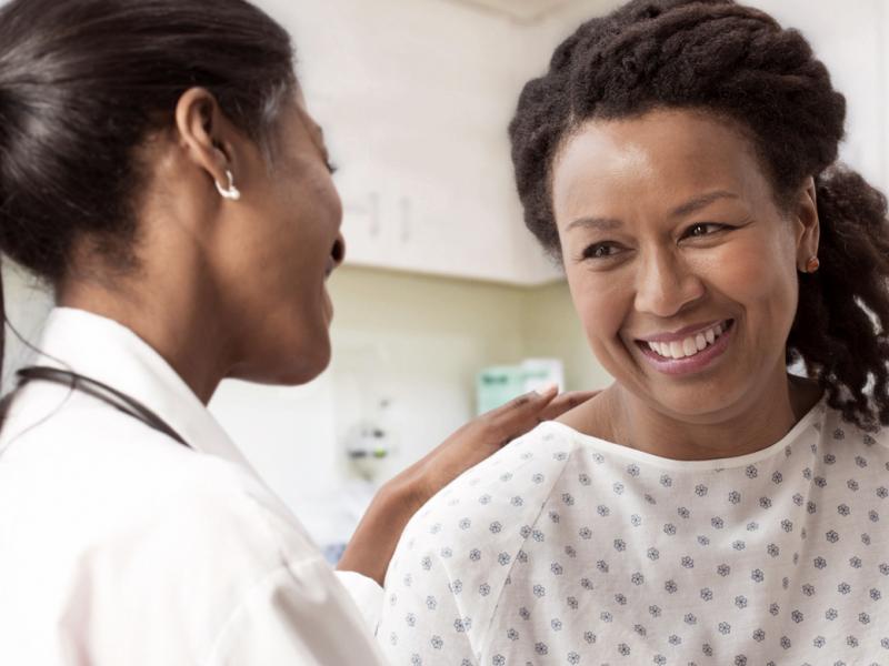 Physician counseling smiling patient