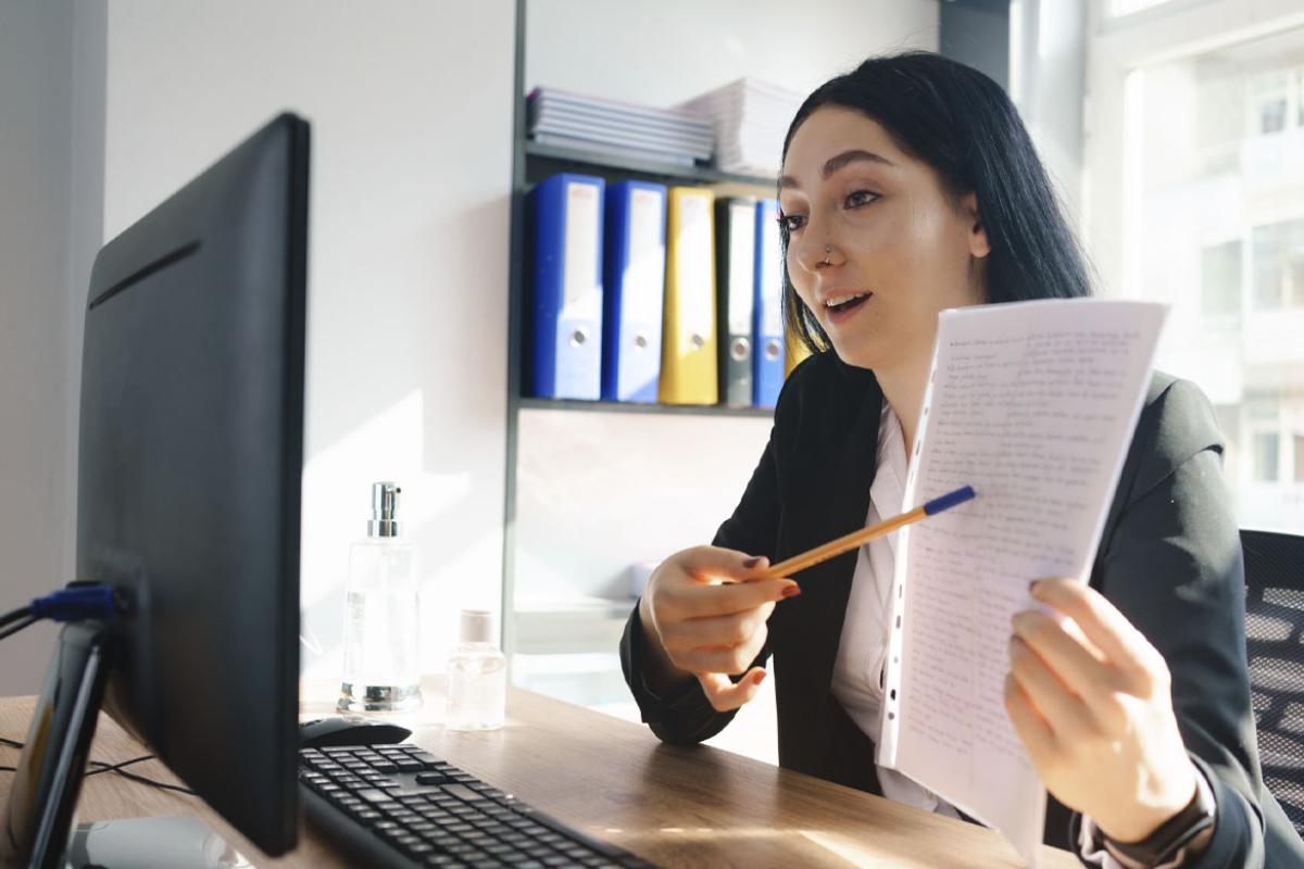 Person pointing contract during video meeting