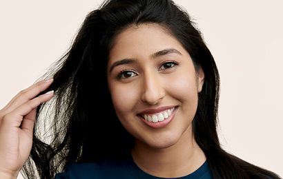 Apple Retail employee with her hand in her hair