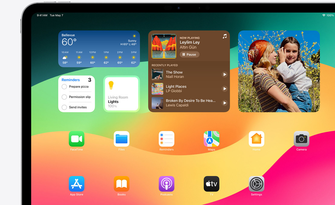 An iPad Pro showcasing Springboard and the different widgets available.