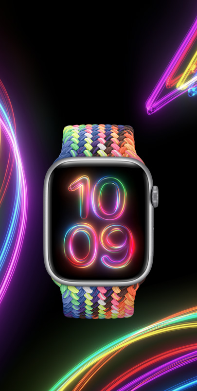 Et Apple Watch Series 9 med den nye Flettet Solo Loop i Pride Edition i mange neonfarver og den matchende urskive Pride-udstråling.