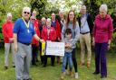 The cheque is presented to Elliot and his mother