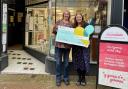 Lowri Roberts and Carla Siswick with the cheque.