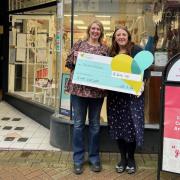 Lowri Roberts and Carla Siswick with the cheque.