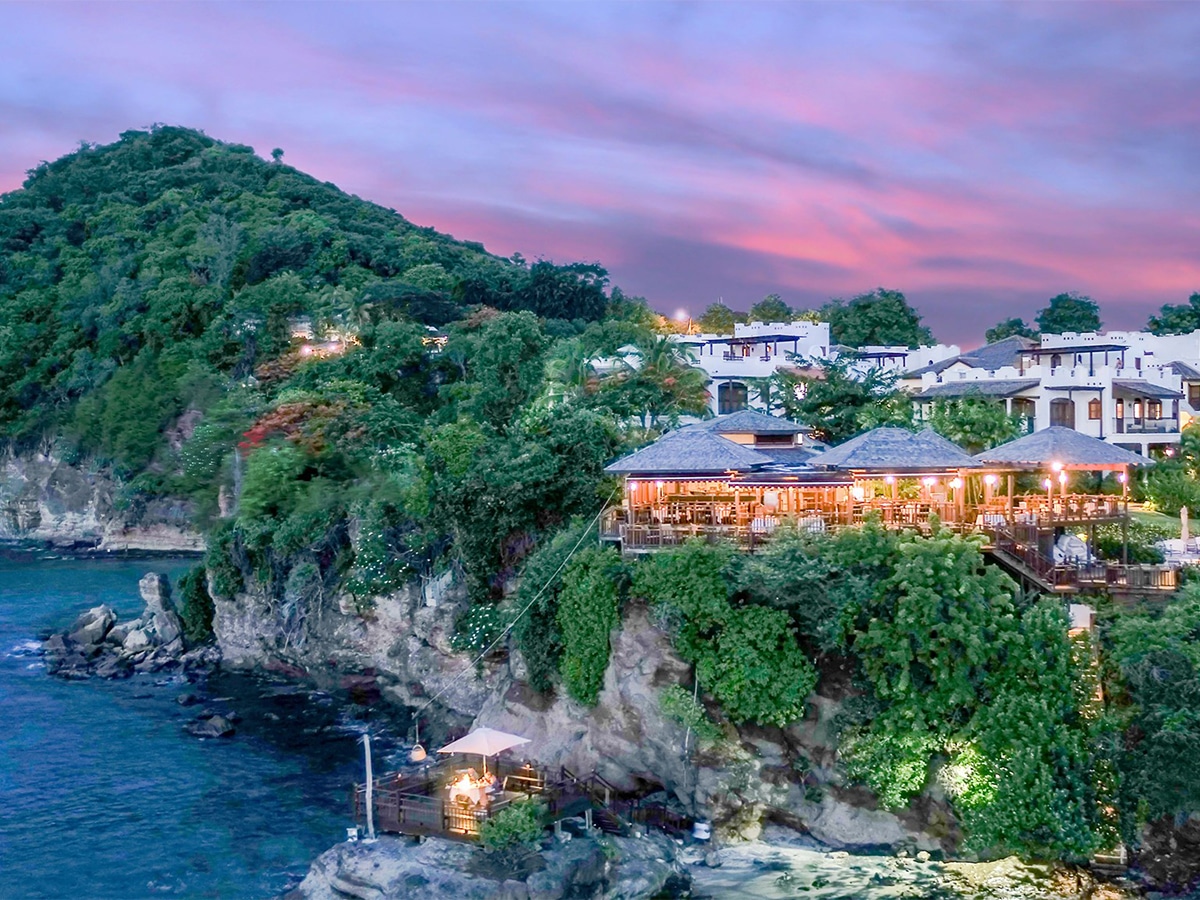 cap maison luxury resort with green hills in background