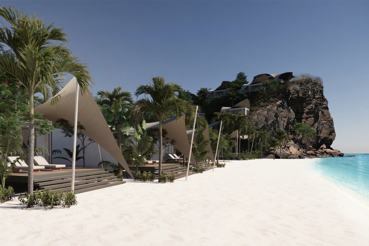 bungalows on the beach with blue water