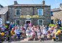 Knitters outside Swaledale Woollens in Muker for the celebration Picture: RICHARD WALLS