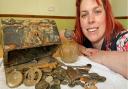 Jennie Fitzgerald, from Sprowston, with the treasure chest, and its contents, that she found on a North Norfolk beach. Picture: Lauren De Boise