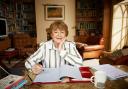 Pam Ayres MBE at desk