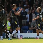 Get in - Gus Scott-Morriss (right) celebrates his goal