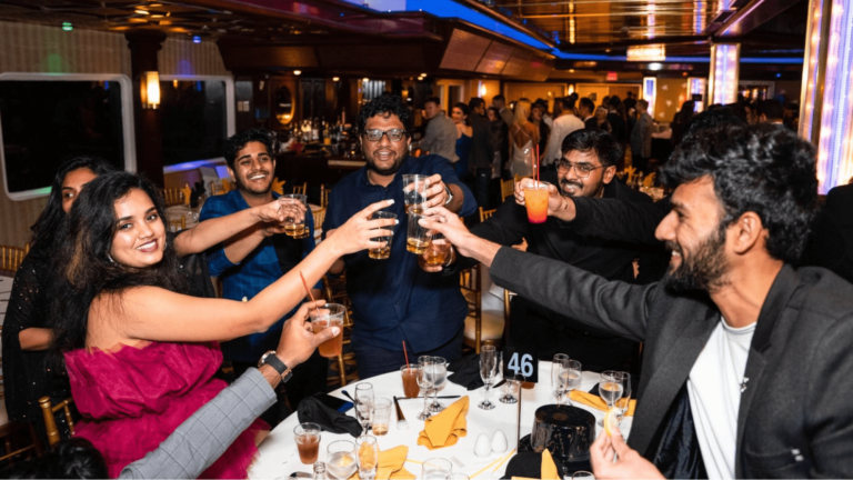 VIP event attendees toasting at a table