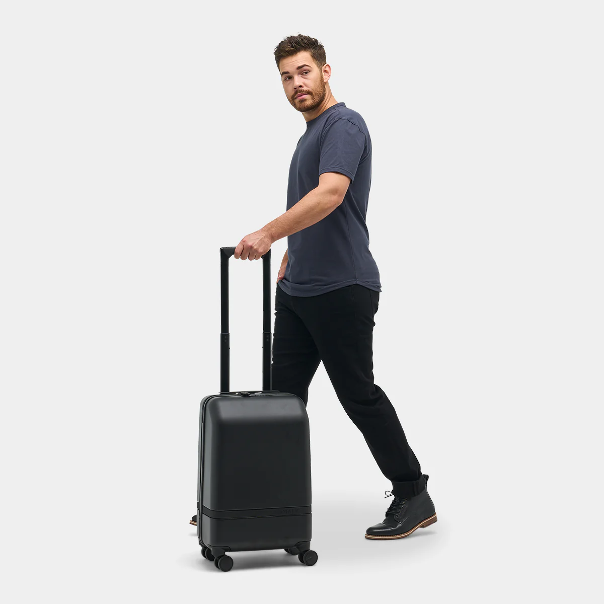 guy with carryon suitcase