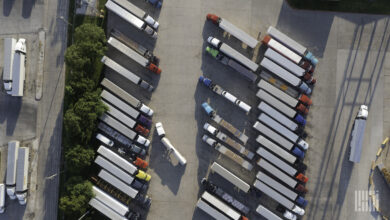 Aerial view of semi trucks parked at a truck stop