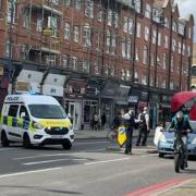 Police at Stoke Newington High Street after a shooting