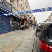 Police cordon on Kingsland High Road where the drive-by shooting took place