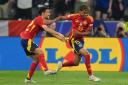 Spain’s Lamine Yamal, right, celebrates after becoming the youngest scorer in European Championship history (Bradley Collyer/PA)