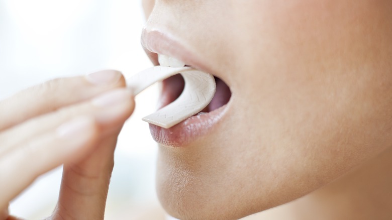 young woman chewing gum