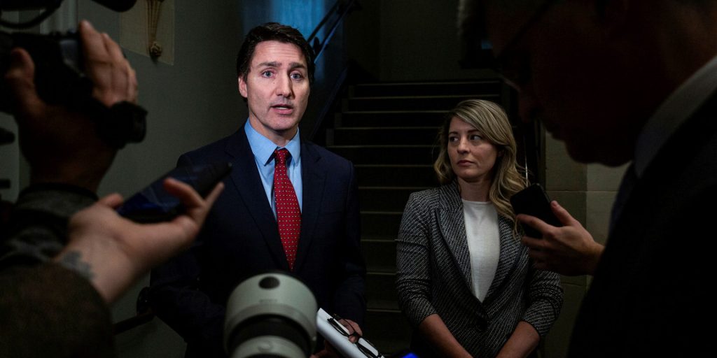 Prime Minister Justin Trudeau and Minister of Foreign Affairs Mélanie Joly speaks with reporters before the Liberal party caucus meeting in West Block on Nov. 22, 2023.