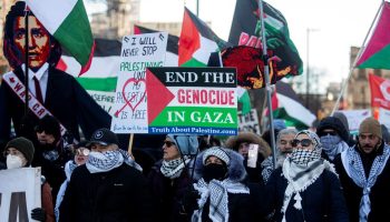 People march in downtown Ottawa on Feb. 17, 2024, to call for an end to Israeli occupation and bombing of Gaza.