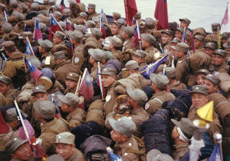 Chinese POWs headed for Taiwan, some of whom hold the flag of the Republic of China, the Nationalist government of Taiwan, 20 January 1954. Bettman/Getty Images.