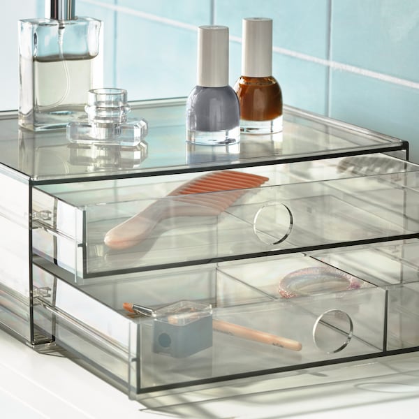 Transparent organizer with beauty products inside.