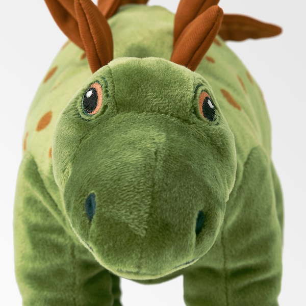 A close-up of a dinosaur soft toy.