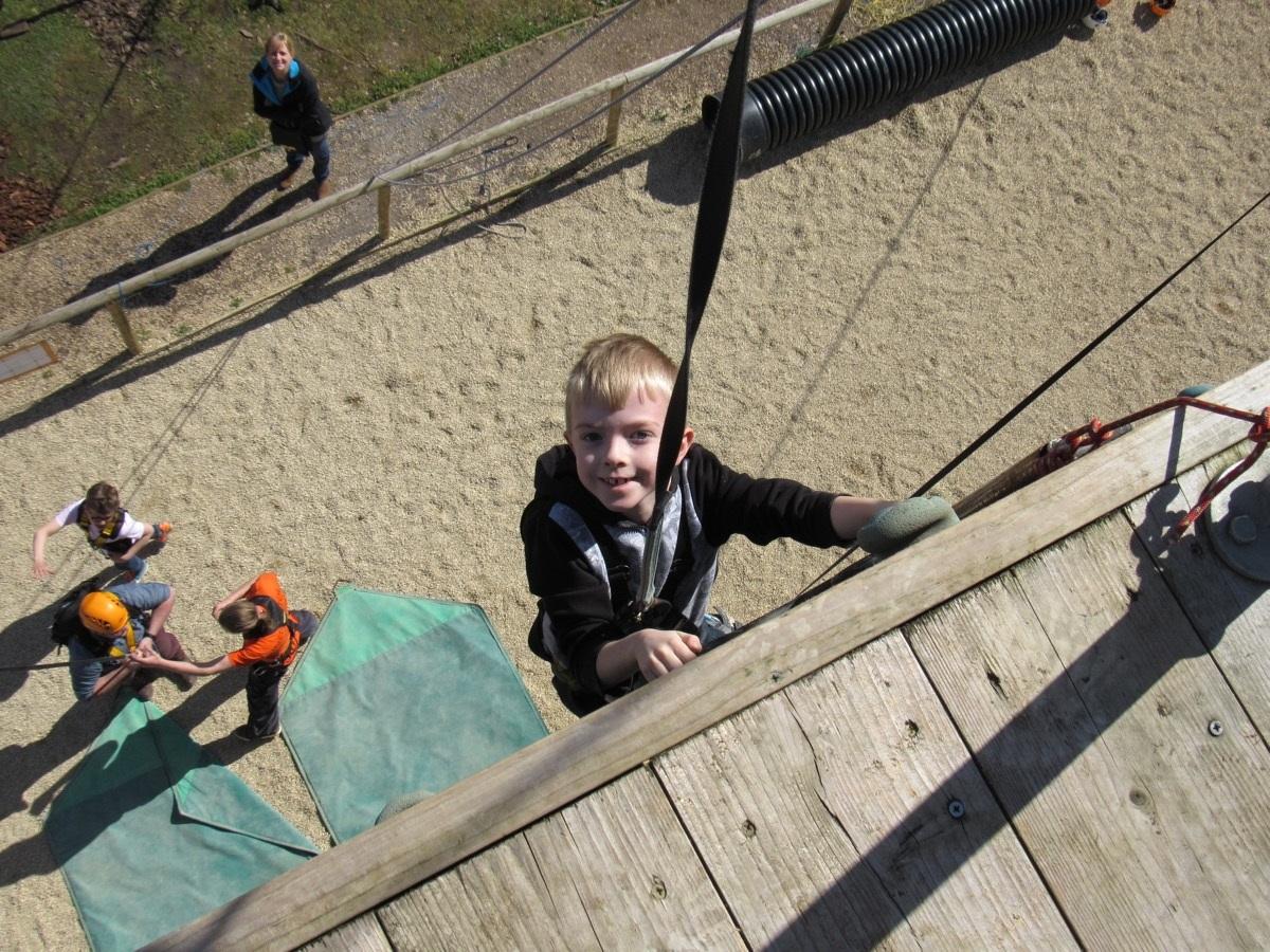 boy climbing wall small.jpg