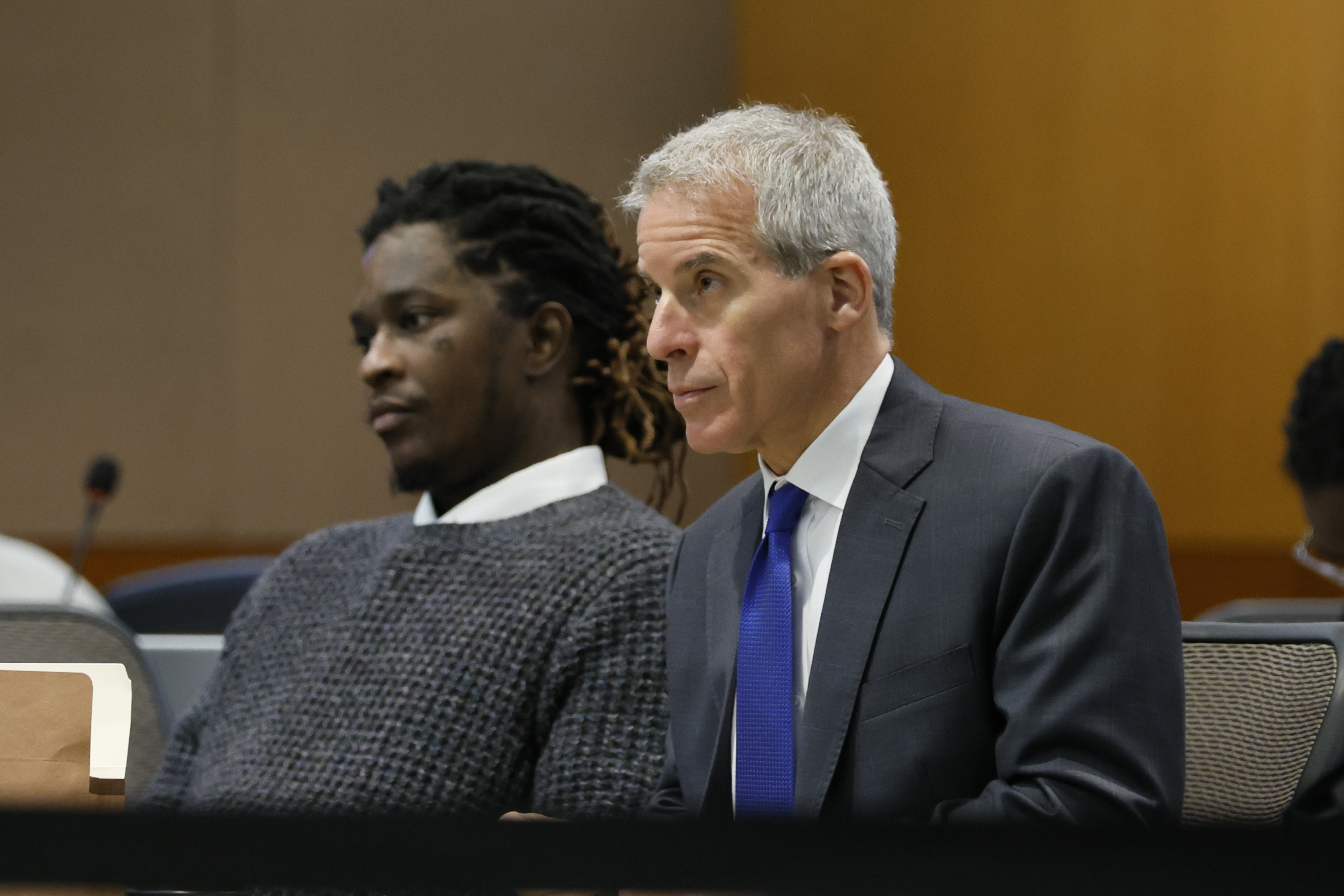 Young Thug, whose real name is Jeffery Lamar Williams, and his lawyer, Brian Steel, watch Judge Ural Glanville speak during the hearing of key witness Kenneth Copeland at the Fulton County Superior Court in Atlanta on Monday, June 10, 2024. (Miguel Martinez/Atlanta Journal-Constitution via AP)