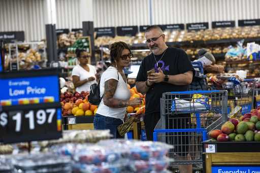 Shoppers pause in the produce section at a Walmart Superstore in Secaucus, New Jersey, July 11, 202…