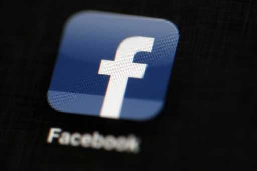 In this May 16, 2012, file photo, the Facebook logo is displayed on a mobile device in Philadelphia…