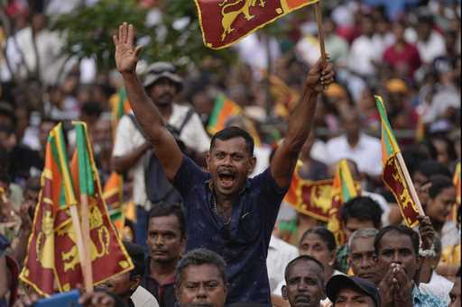 A supporter of Sri Lanka's president Ranil Wickremesinghe cheers during a public rally in Colombo, …