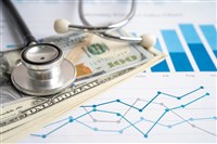 Stethoscope with US dollar banknotes on chart and graph paper, Finance, Account, Statistics, Investment, Analytic research data economy and Business company concept.