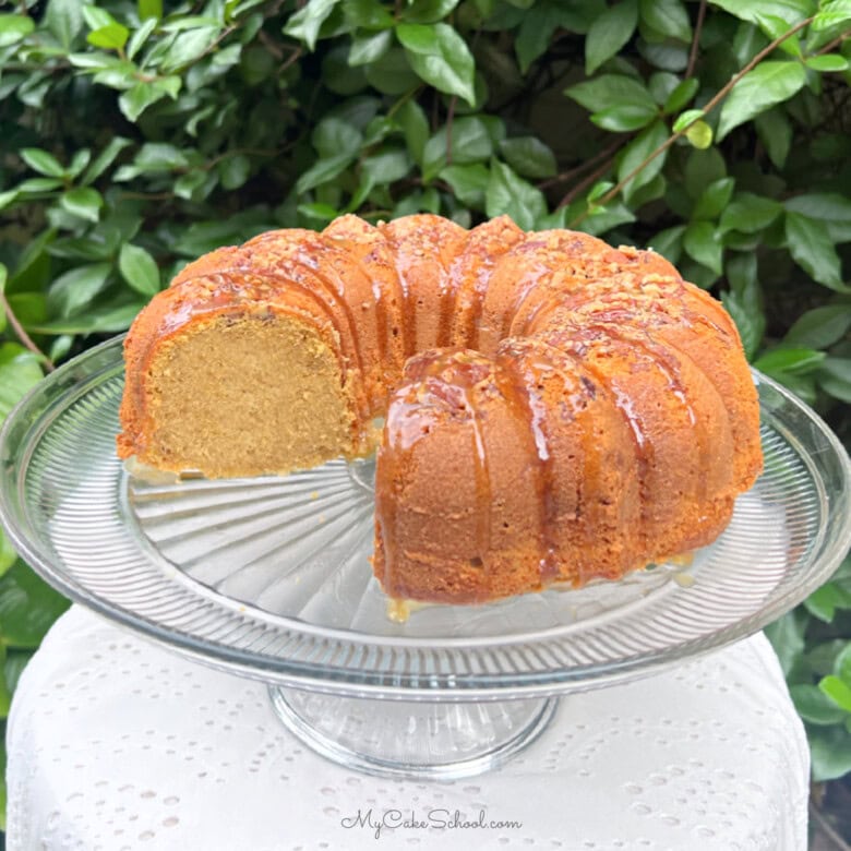 Sweet Potato Pound Cake, sliced, on a pedestal.