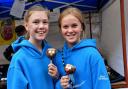 Rebecca Musgrave and Eryn Barker about to tuck into dog-shaped chocolate lollies