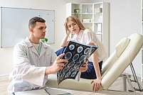 Doctor showing patient a scan of a deep brain stimulation device.