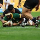 All Black Reiko Ioane can't stop South Africa captain Siya Kolisi from scoring a try. Photo:...