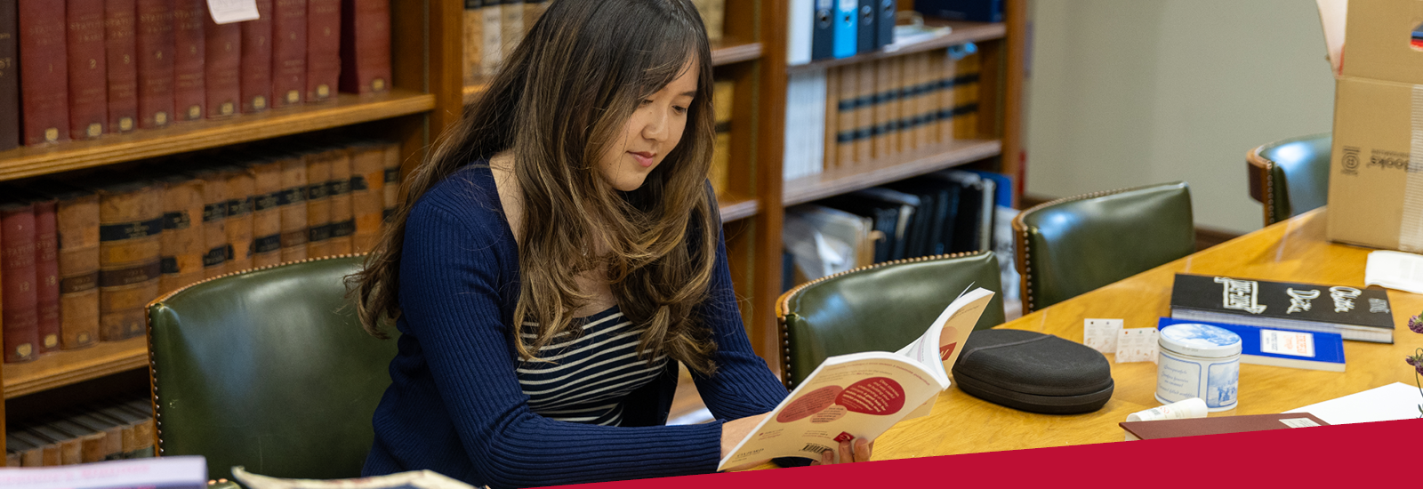 Photograph of a student in a library