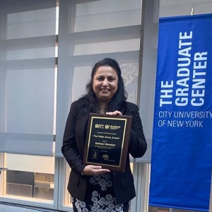 Dr. Sarbani Ghoshal, Assistant Professor, holding award