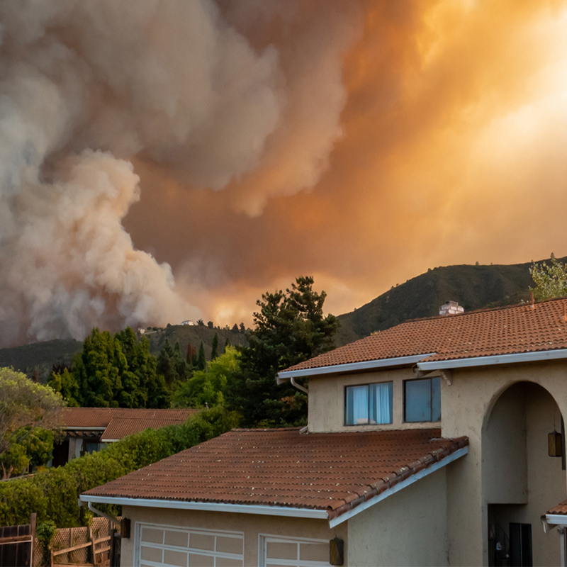 A house with smoke in the background