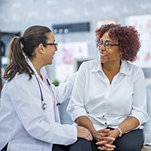 Female doctor talking to patient.