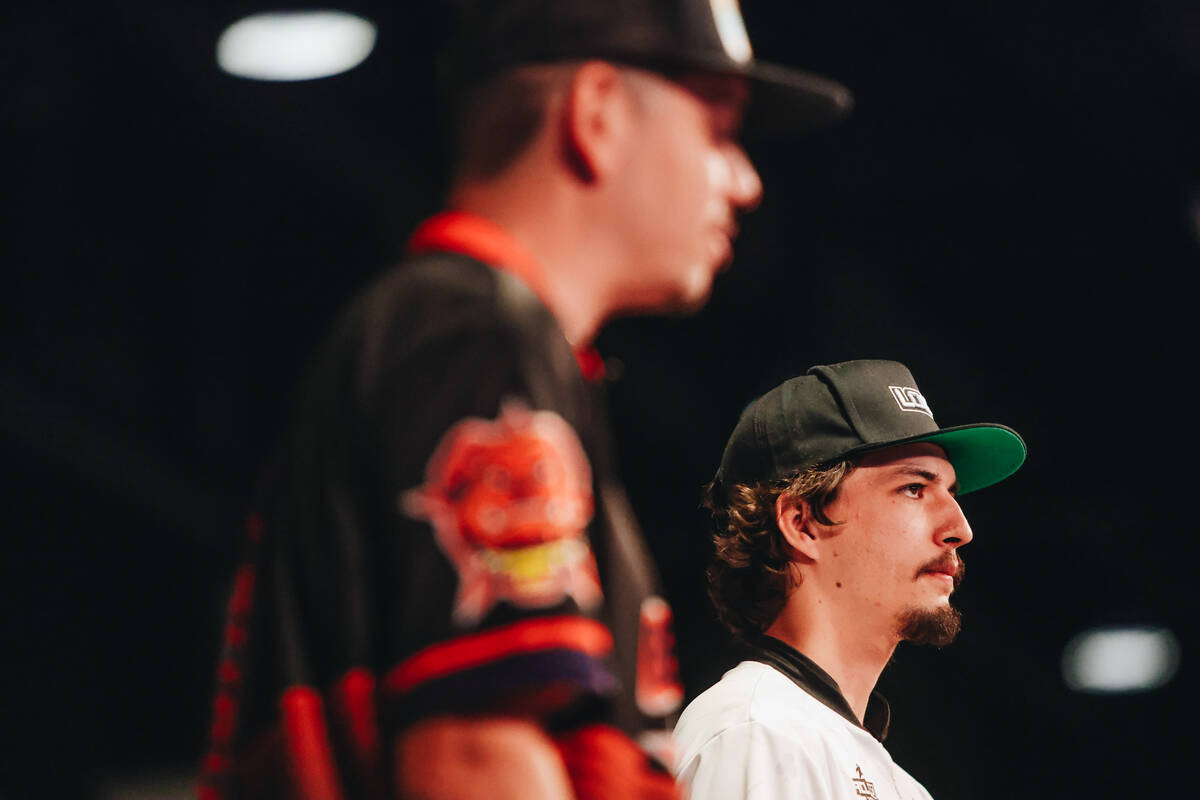 The Las Vegas High Roller’s Hunter Thorne, right, throws a bean bag during a cornhole ma ...