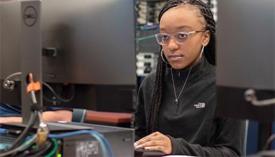 Student working intently at a computer. 