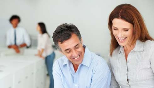 business people looking over sustainability reporting paperwork